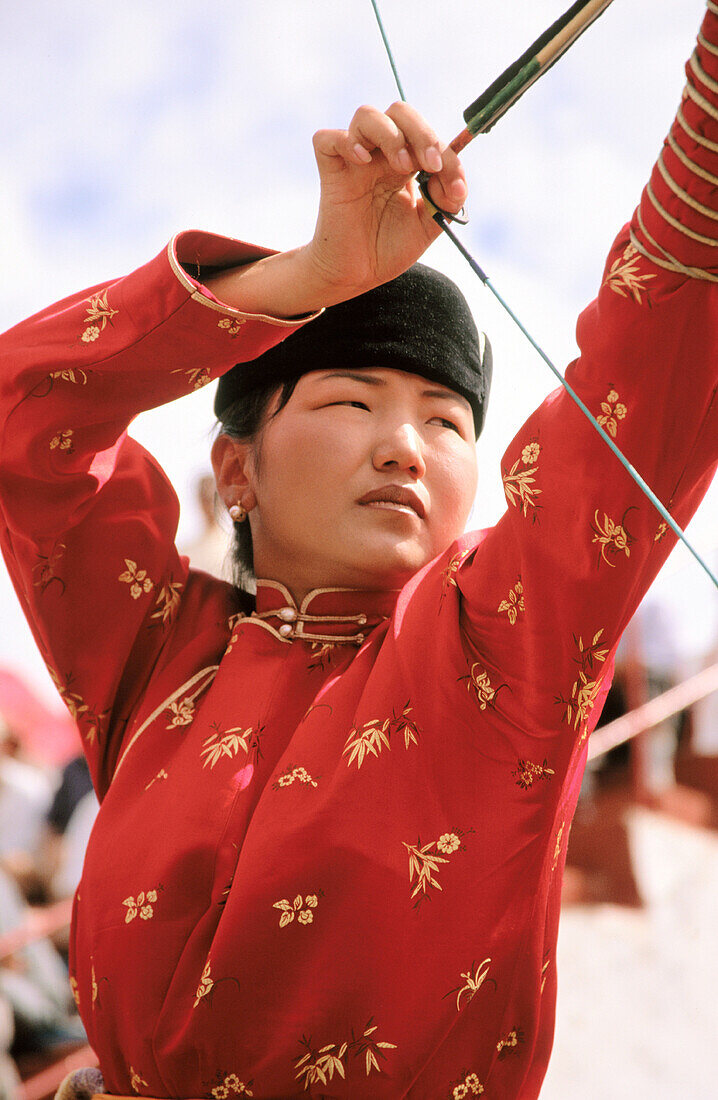 Archery competitors in traditional costume. Naadam Festival. Ulan Bator. Mongolia
