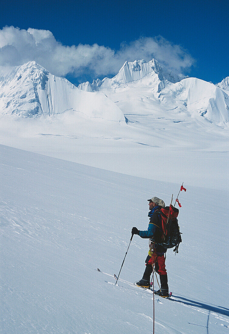 Ski mountaineer and unclimbed 6.000 peaks (unnamed). Lhagu glacier area, Kangri Garpo mountains. South Eastern Tibet