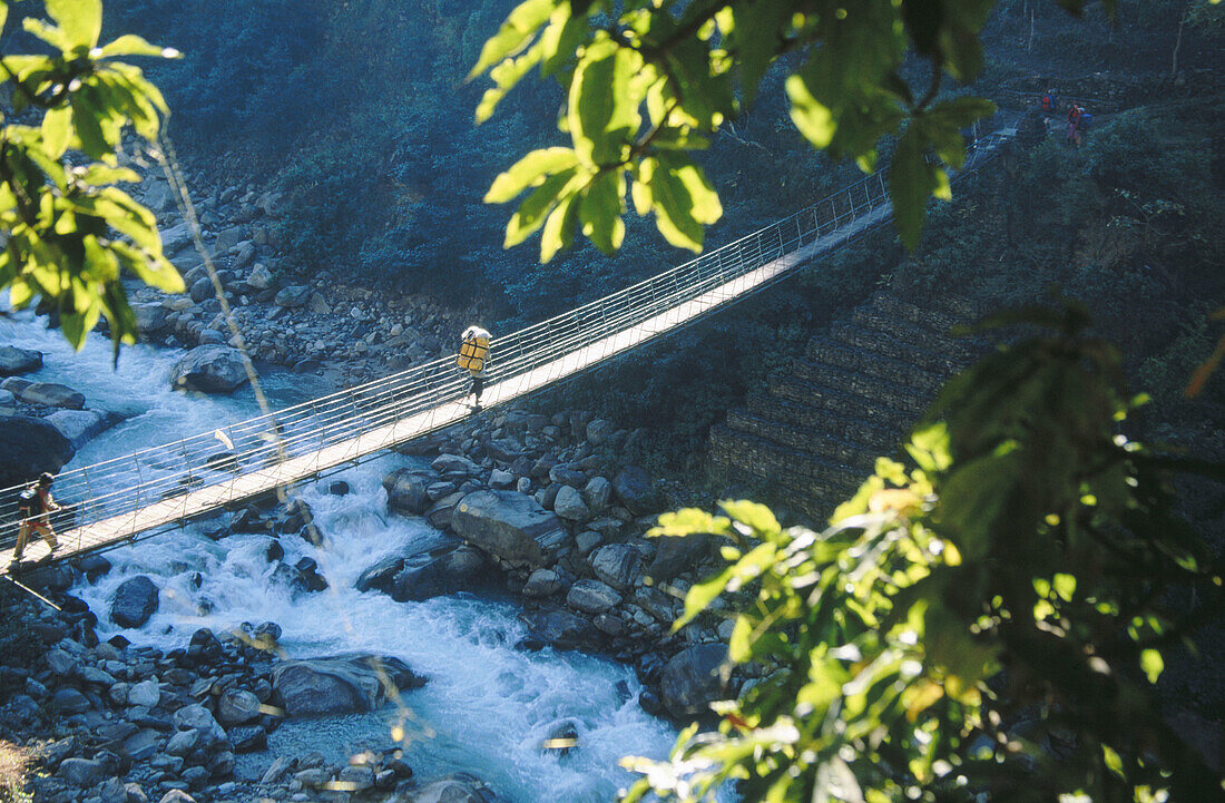 Crossing swing bridge. Jogidanda, Tamur Valley. Kangchenjunga. East Nepal