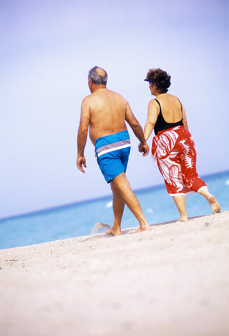Mature couple walking at the beach, Florida, USA