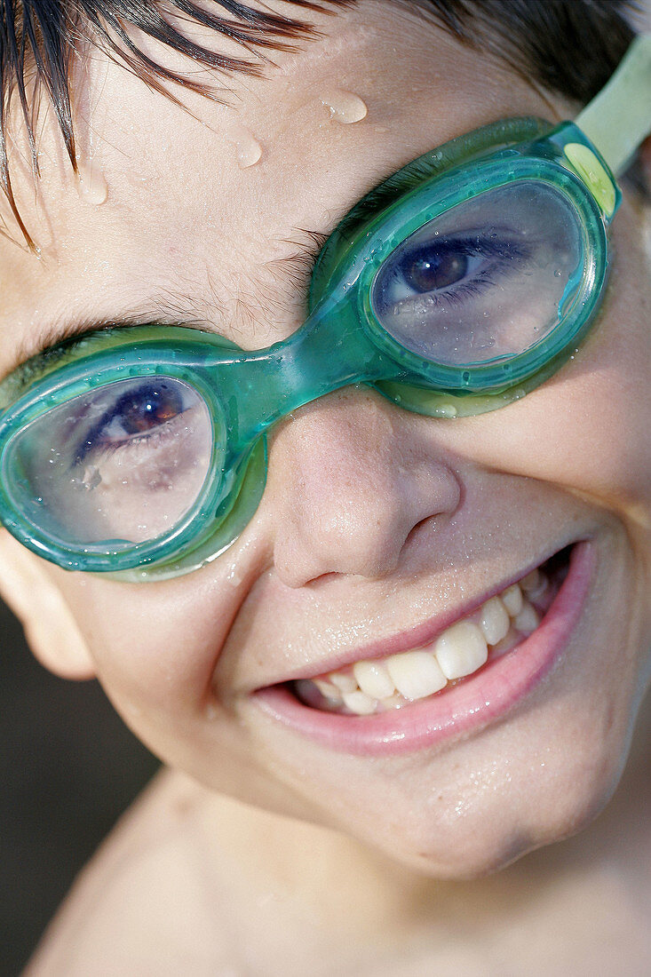 ildhood, Children, Close up, Close-up, Closeup, Color, Colour, Contemporary, Dark-haired, Daytime, Exterior, Face, Faces, Facial expression, Facial expressions, Goggles, Green, Grin, Grinning, Happine