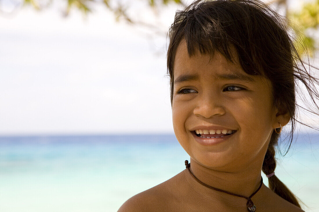 Smiling girl at Tuamotu Islands, French Polynesia, Polynesia, Oceania