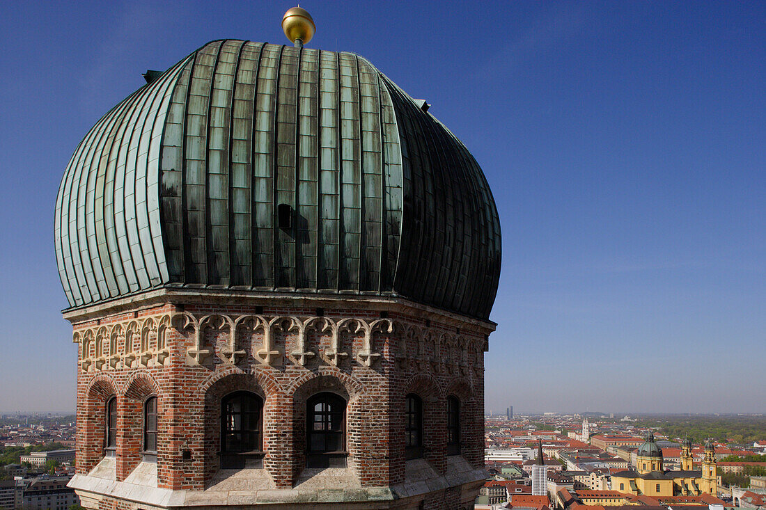 View at one of the towers of Frauenkirche, Theatinerkirche in the background, Munich, Bavaria, Germany