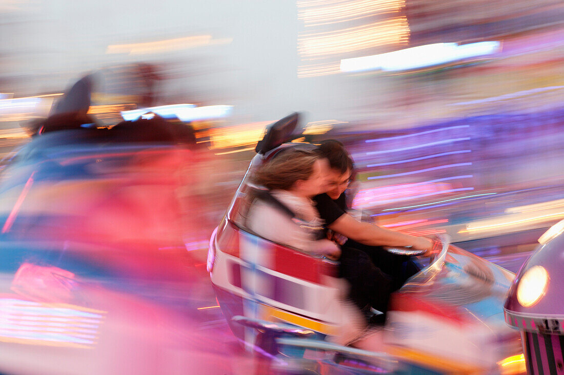 People at Carnival ride in the evening, Oktoberfest, Munich, Bavaria, Germany