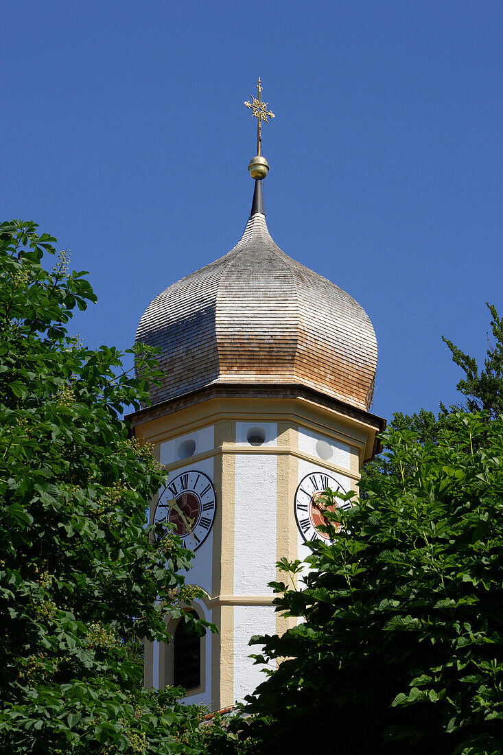 Steeple of old church St. Peter and Paul under a blue summer sky, Tutzing, Bavaria, Germany