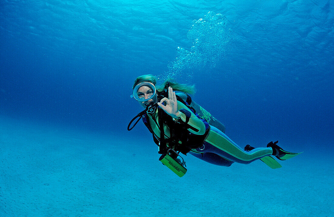 Scuba diver shows o.K. signal, Netherlands Antilles, Bonaire, Caribbean Sea