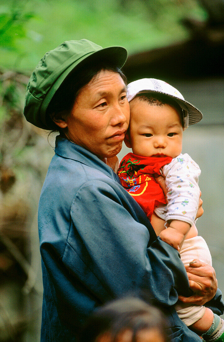 Lisu mother with her young. Yunnan. China