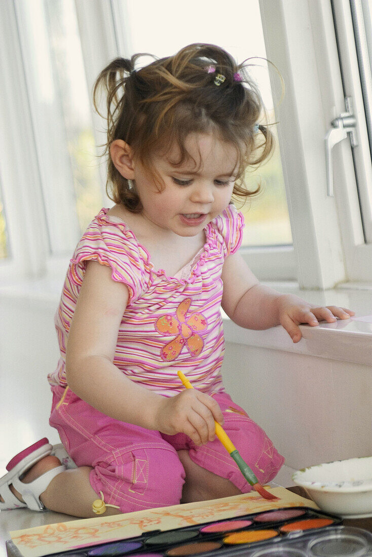 Little girl painting