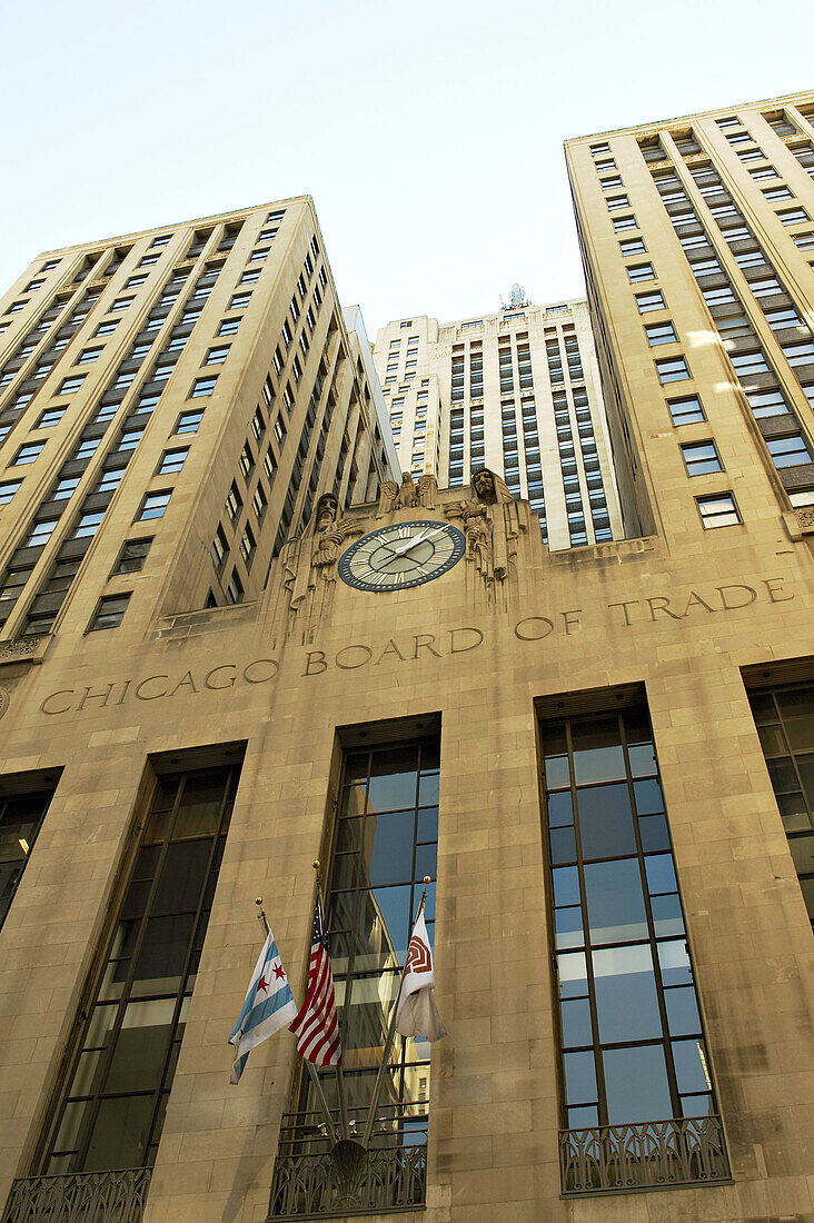 USA, Illinois, Chicago. Chicago Board of Trade building and carved name, exterior, flags