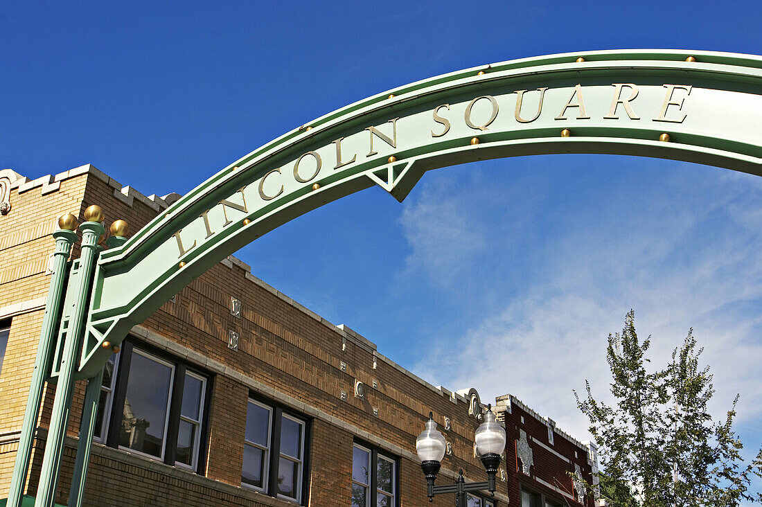 Lincoln Square sign arch over street in shopping district. Chicago. Illinois, USA