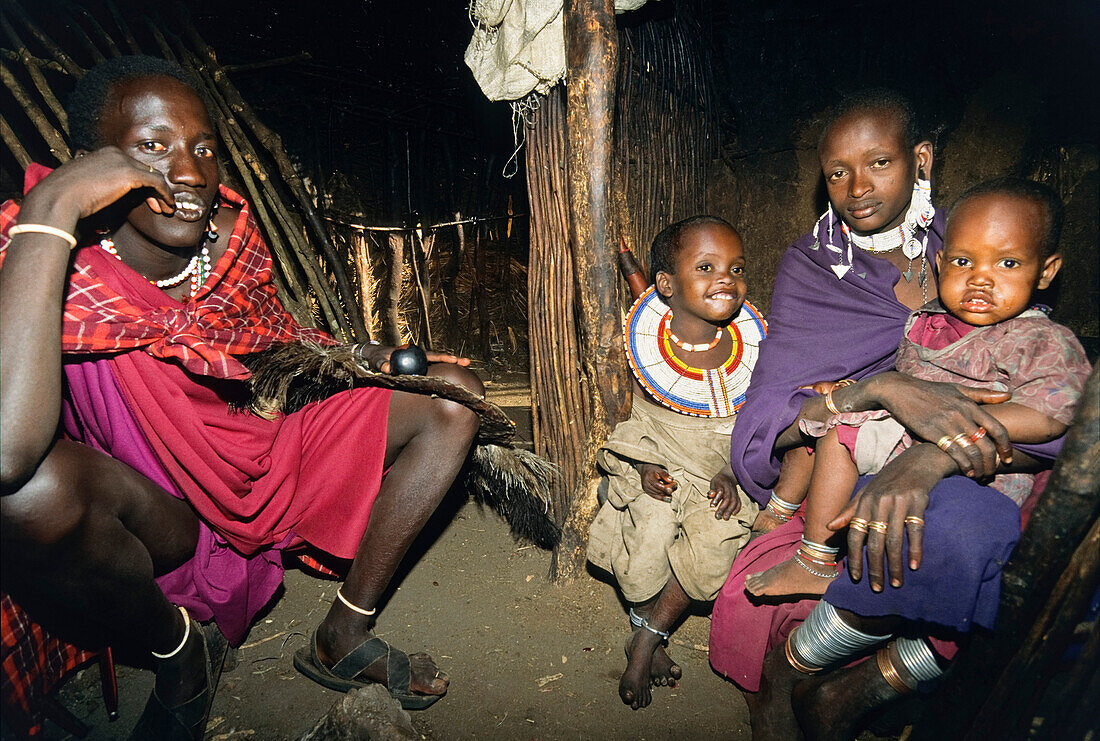 Massai family in her traditional house, Tanzania, East Africa