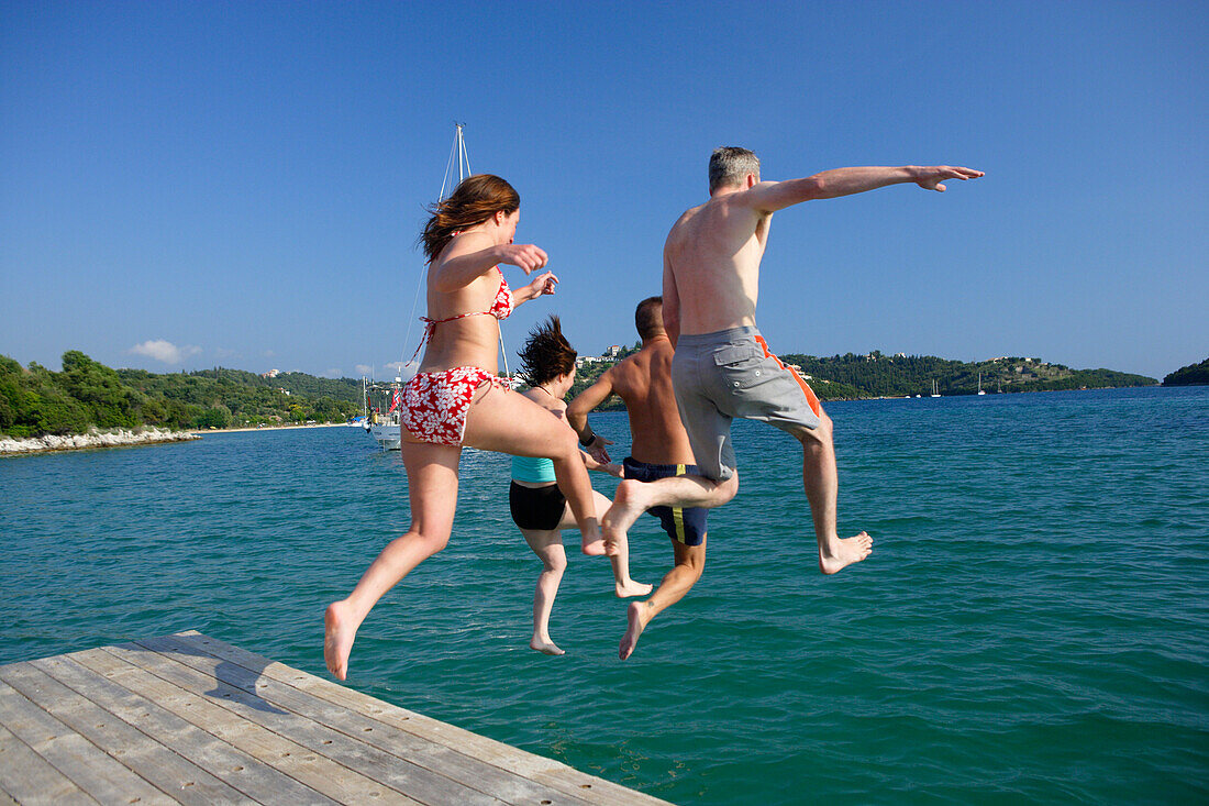 Mourtos, jumping off  the boardwalk of the marina