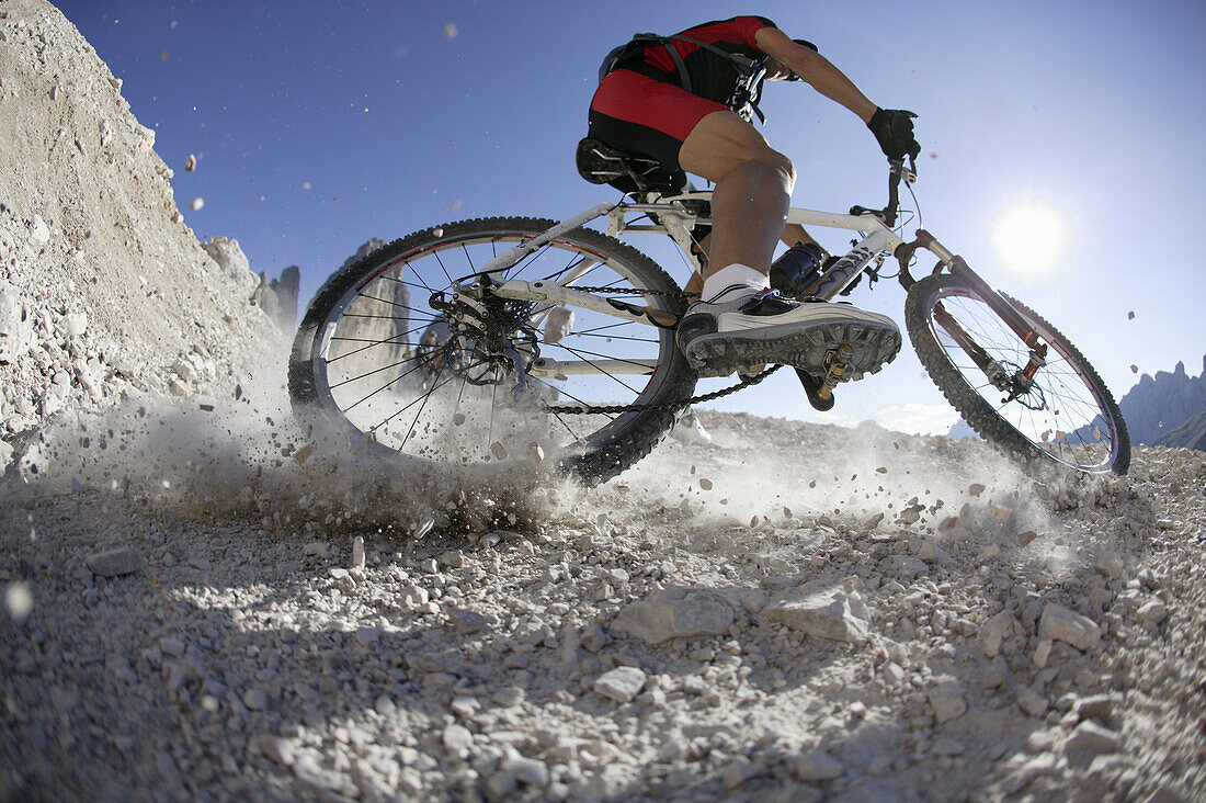 Mountain biker on mountain path, Tre Cime di Lavaredo, Dolomites, Veneto, Italy