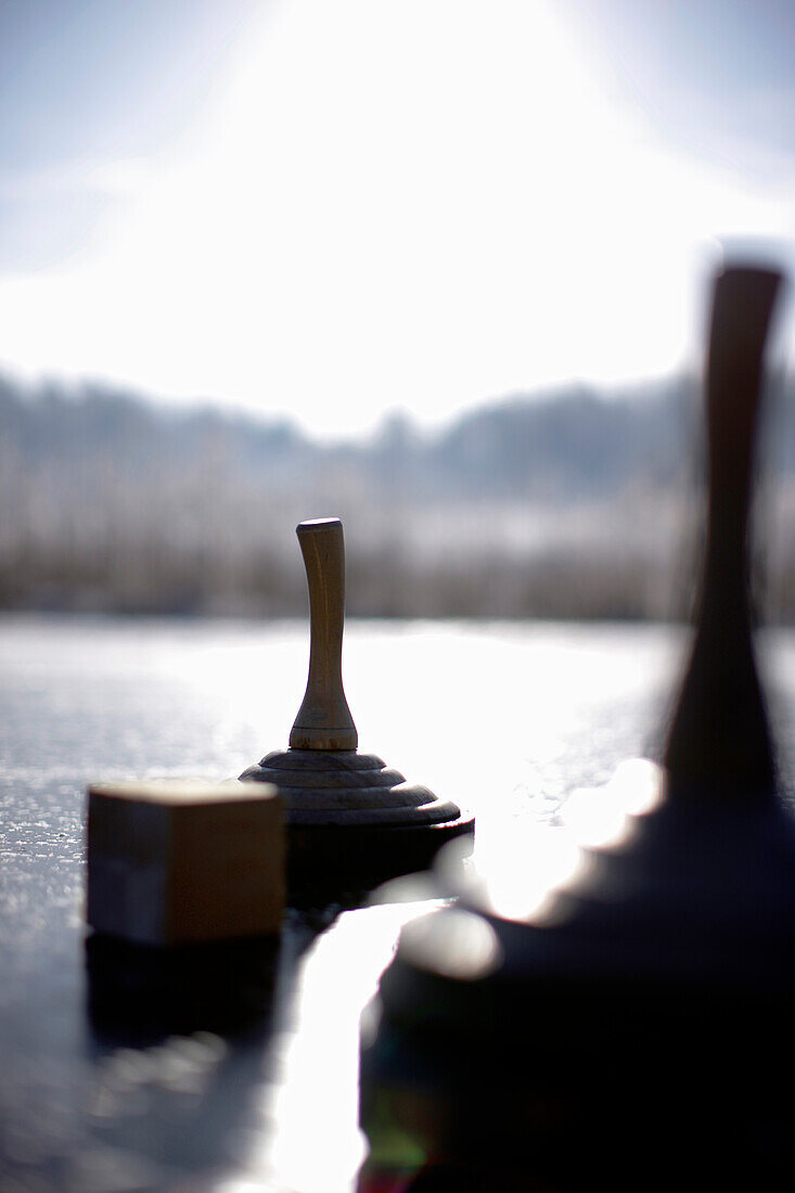 Ice stocks on lake Buchsee, Munsing, Bavaria, Germany