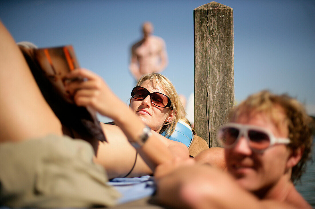 Young couple at a yetty at Lake Starnberg, Feldafing, Bavaria, Germany