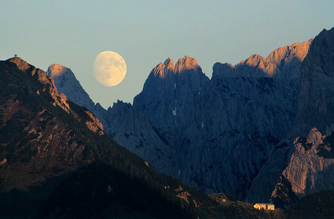 moonrise above Wilder Kaiser range with alpine hut Stripsenjochhaus, Wilder Kaiser range, Kaiser Mountain Range, Tyrol, Austria