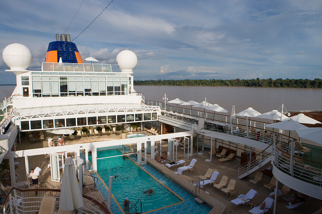 Swimming pool of MS Europa during a cruise on the Amazon River, Near Rio do Cajari, Para, Brazil, South America