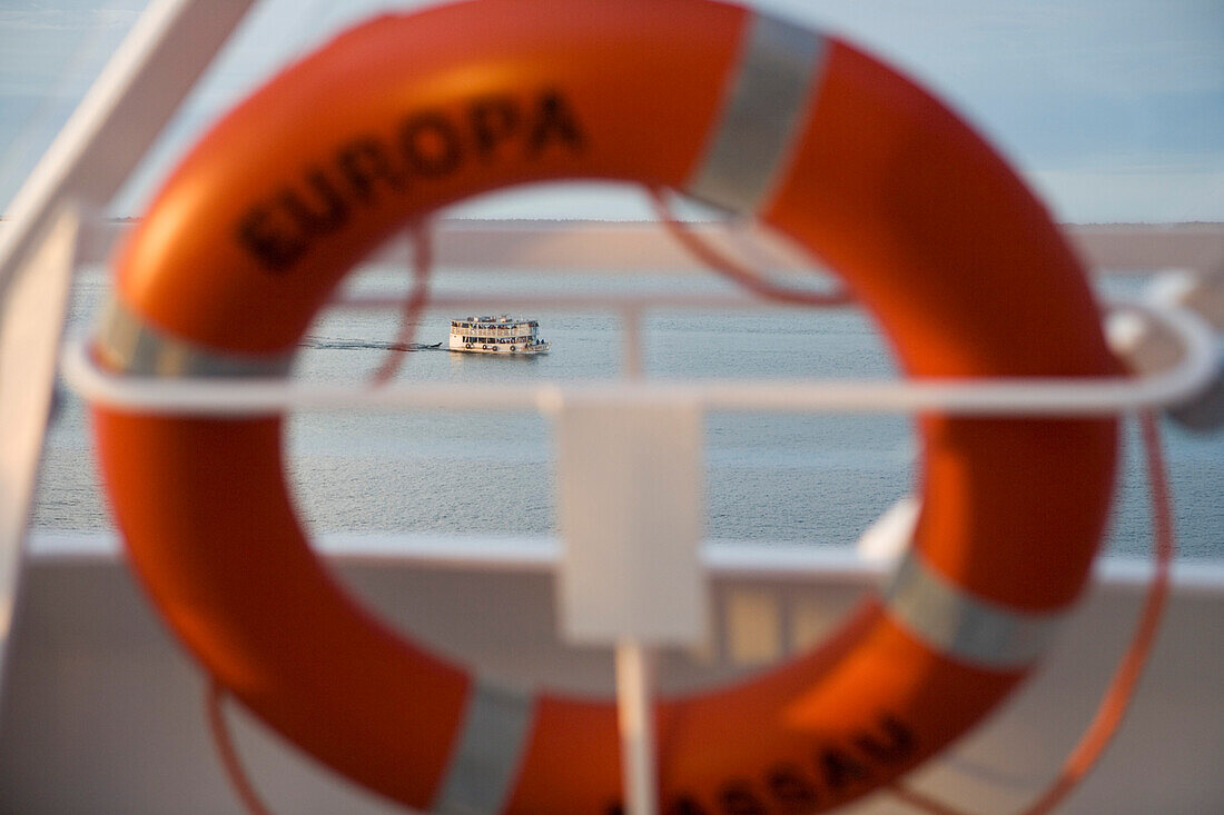 MS Europa Life ring and Amazon River Boat in the background, Santarem, Para, Brazil, South America