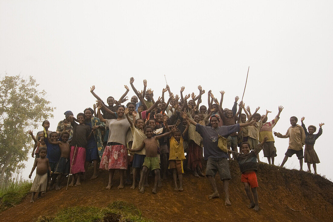 A group of cheering children, Langila, Papua New Guinea, Oceania