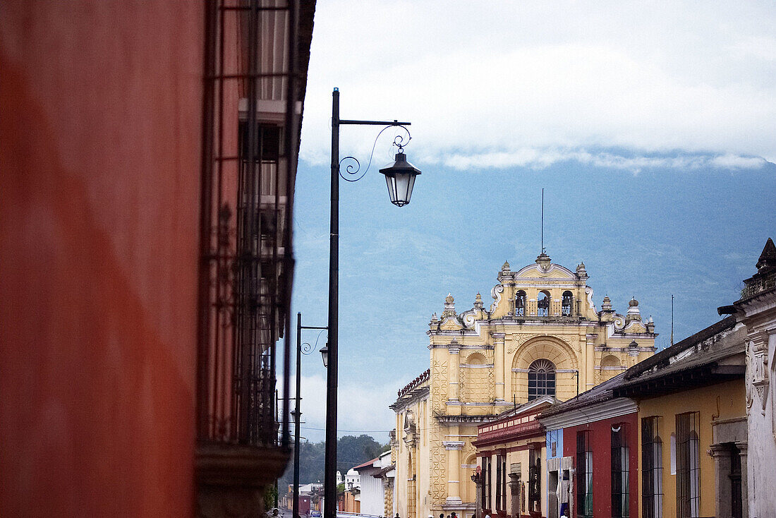 View of Antigua with San Pedro Apóstol church and Agua Volcano in the background. Antigua Guatemala. Sacatepéquez Region. Guatemala