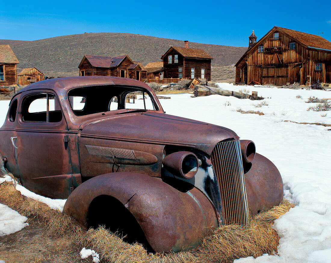 Abandoned vintage car in snow. Bodie State Historic Park. Mono county. California. USA