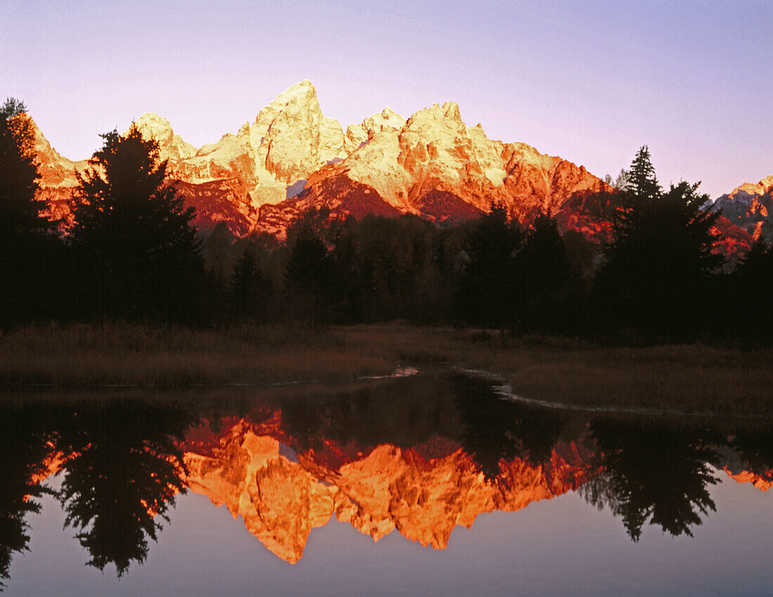 Sunrise on the Tetons from Schwabacher Landing. Snake River. Grand Teton National Park. Teton County, Wyoming. USA.