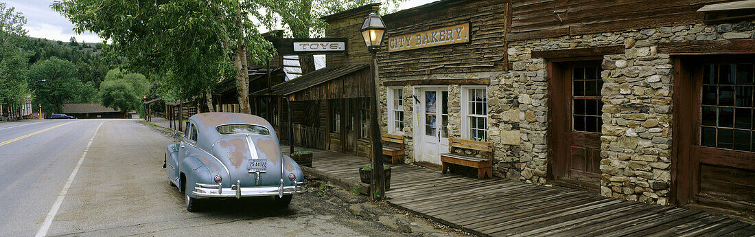 Antique car on main street National Historic Landmark, Virginia City (town former capital of Montana territory). Madison County, Montana. USA