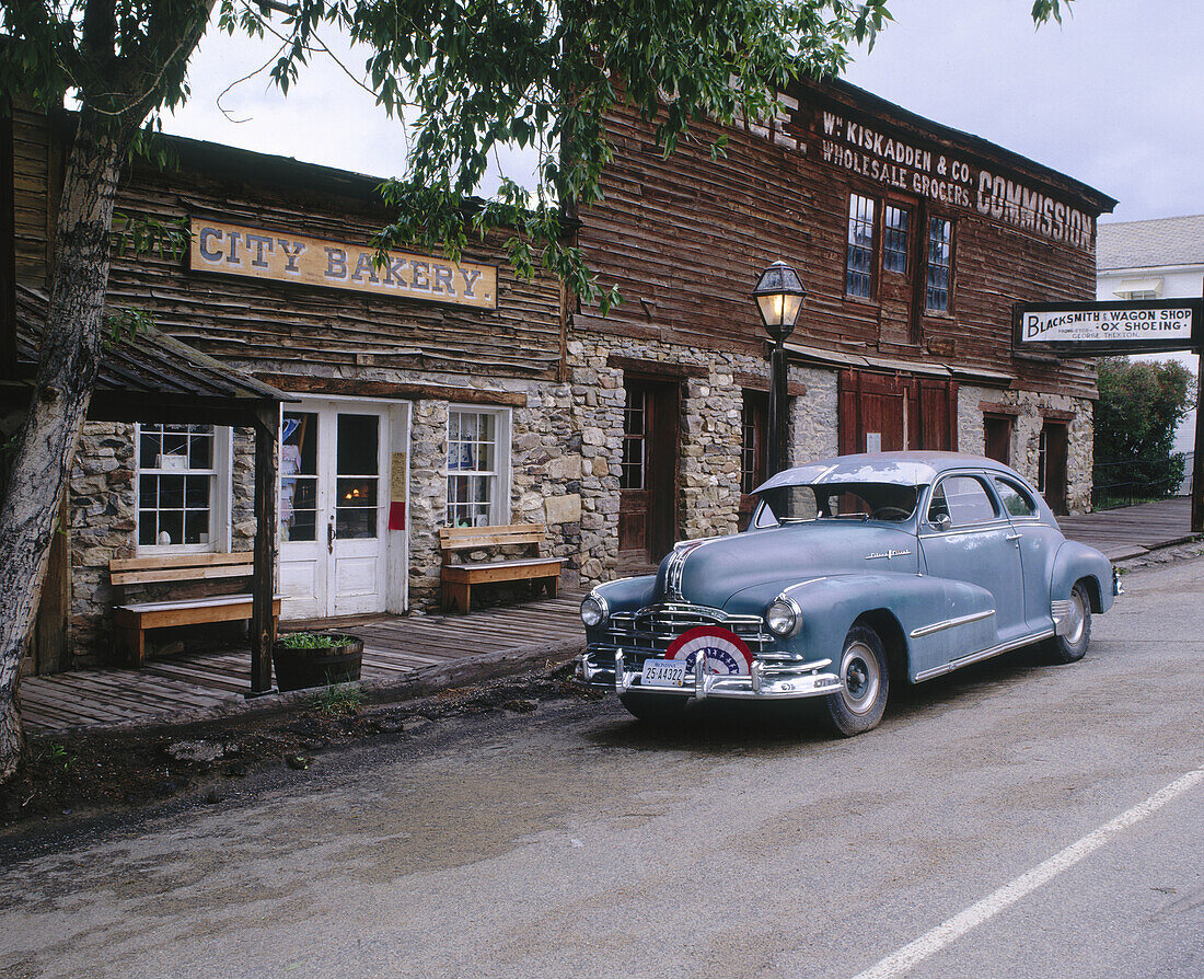 Vintage car on main street National Historic Landmark, Virginia City (town former capital of Montana territory). Madison County, Montana. USA