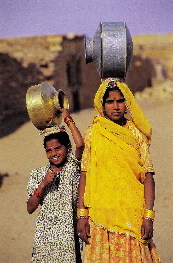 Girls in search of water in the surroundings of Thar Desert. Rajasthan. India