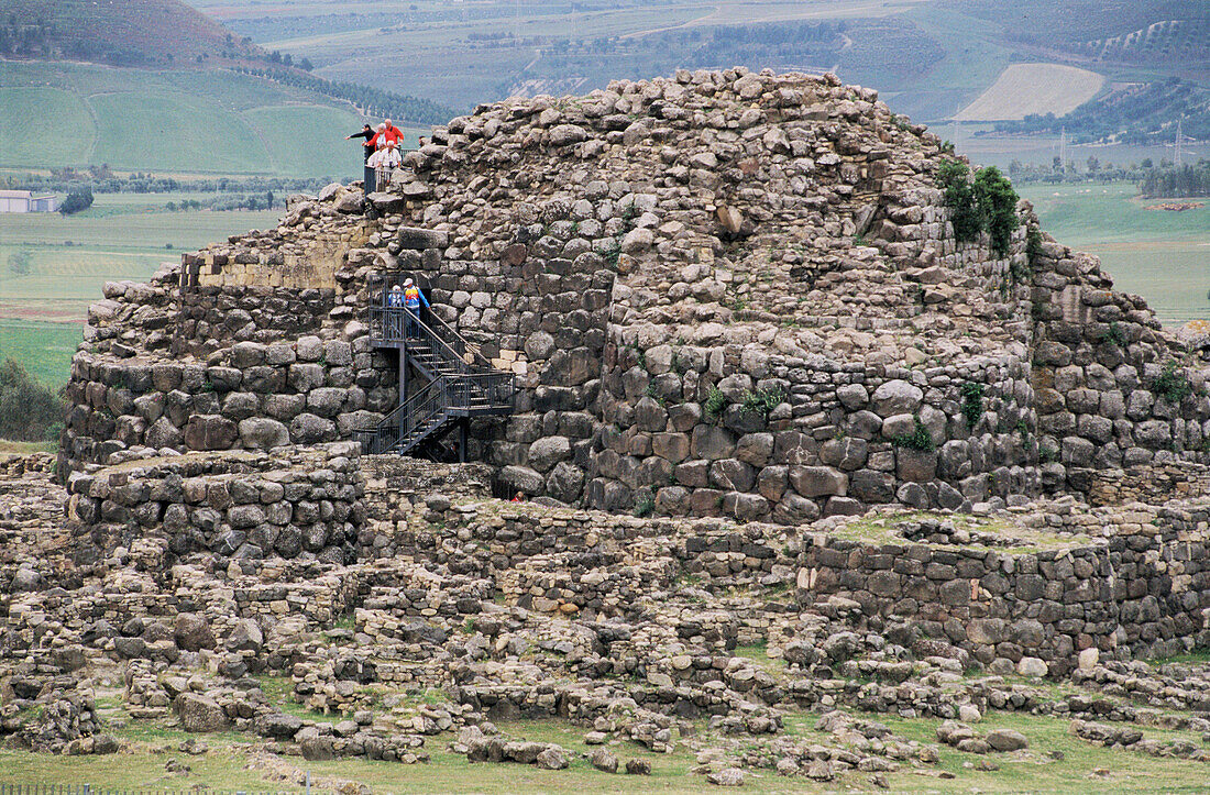 Su Nuraxi, nuraghe or towerlike monument and fortified dwellings dating Bronze Age at Barumini. The major tower of the Su Nuraxi Barumini Nuraghe goes up to the XII-XI century B.C.Polylobe Nuraghe. Unesco protected site. Sardinia, Italy