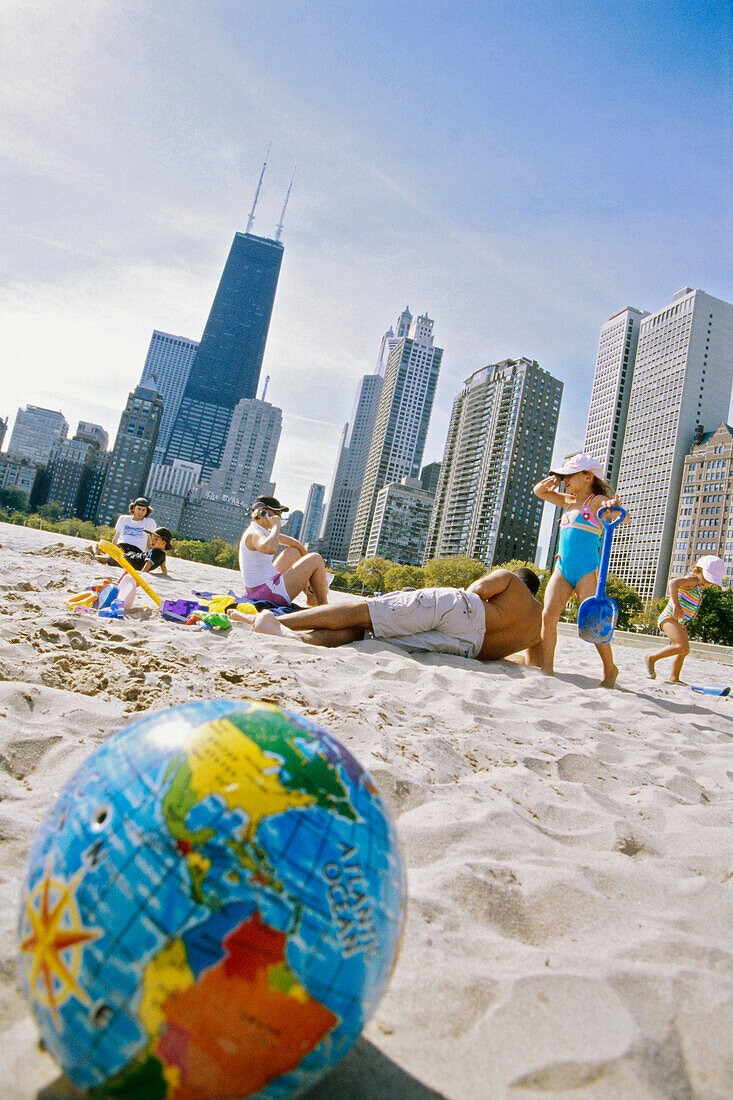 Young family on North Beach with Skyline Chicago, Illinois, USA