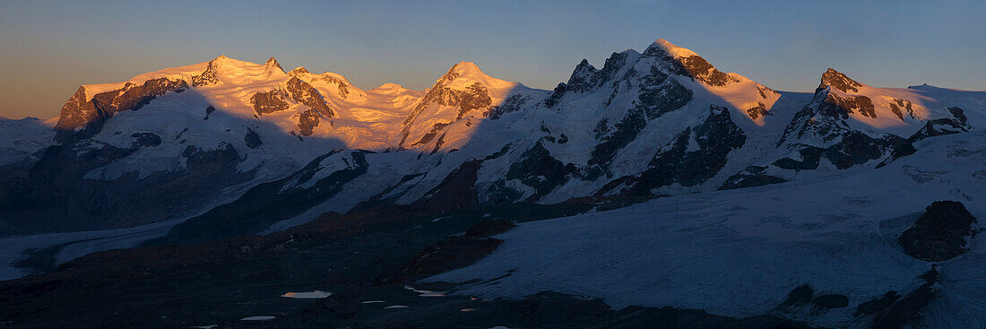 Alpenglow, Panorama, from left to right the four-thousanders Monte Rosa, Liskamm and Breithorn, Canton Wallis, Switzerland