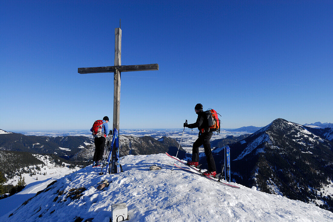 two backcountry skiers arriving at summit of Schönkahler, Allgaeu range, Allgaeu, Schwabia, Bavaria, Germany
