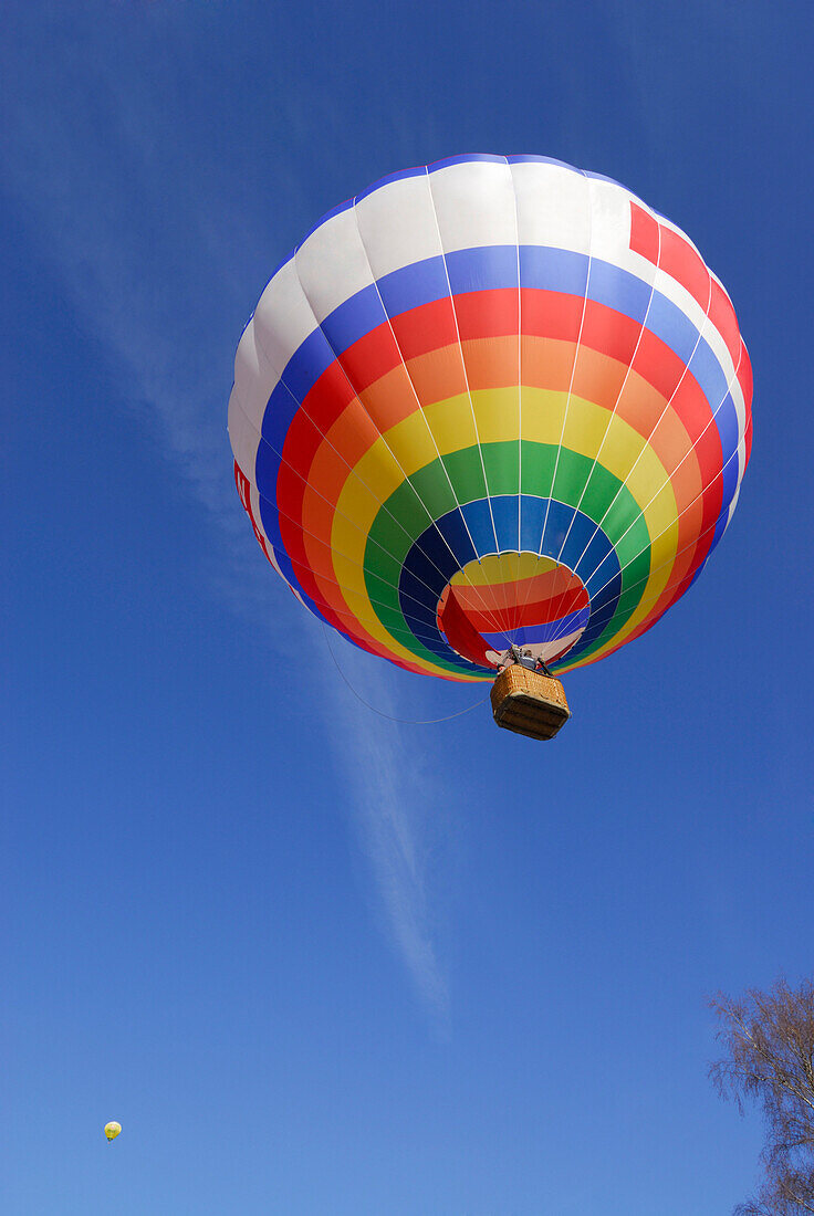 Hot-air balloon against blue sky, Bad Wiessee at lake Tegernsee, Bavaria, Germany