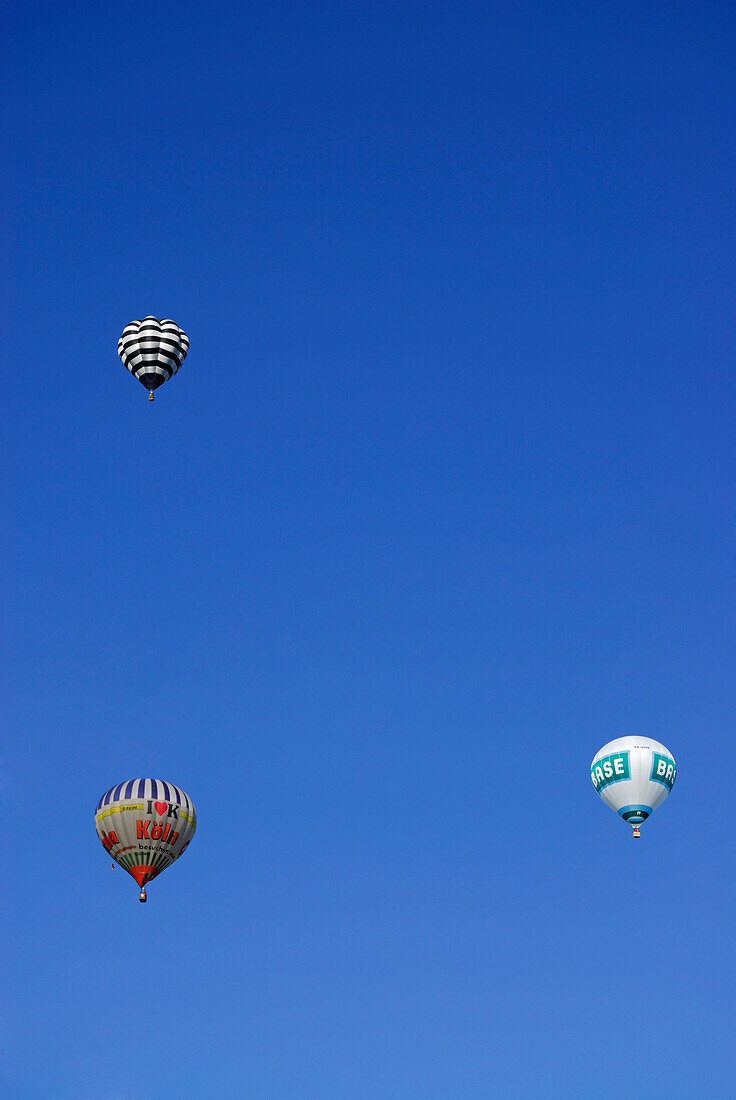 ballooning,  three balloons in the air, Montgolfiade in Bad Wiessee at lake Tegernsee, Upper Bavaria, Bavaria, Germany