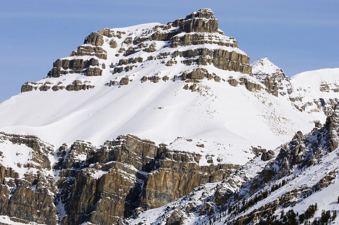 Mountain crag and slopes along Icefield Parkway. Banff National Park, Alberta, Canada 