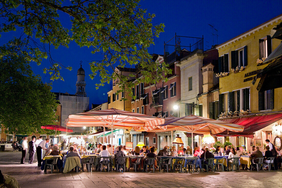 People sitting outside a restaurant bar, Campo Santa Margherita, Venice, Veneto, Italy