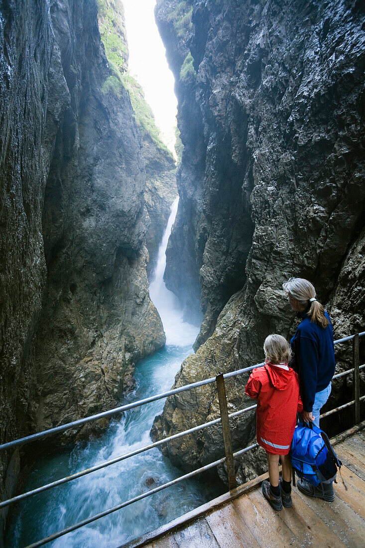 Mother and daughter on bridger over Leutasch gorge, Mittenwald, Upper Bavaria, Germany