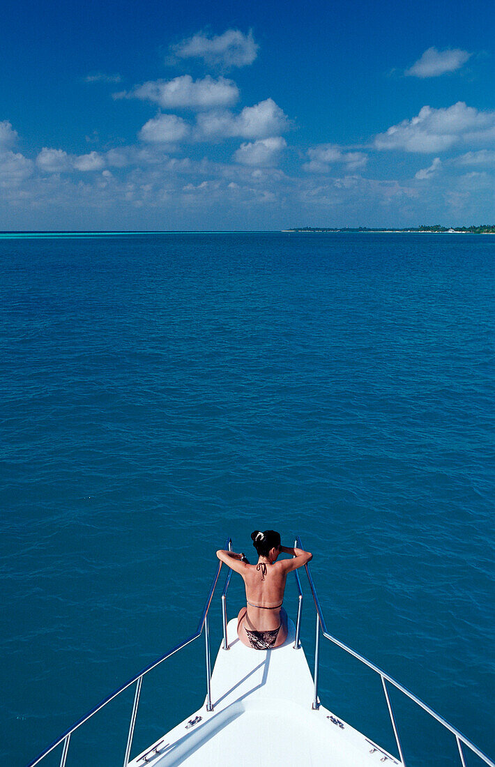Tourist sitting on Bow, Maldives, Indian Ocean, Medhufushi, Meemu Atoll