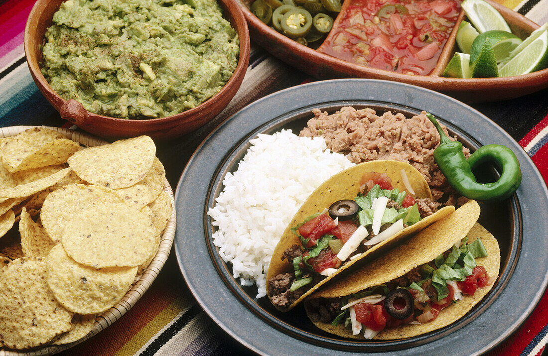 Tostadas, guacamole, salsa and tacos