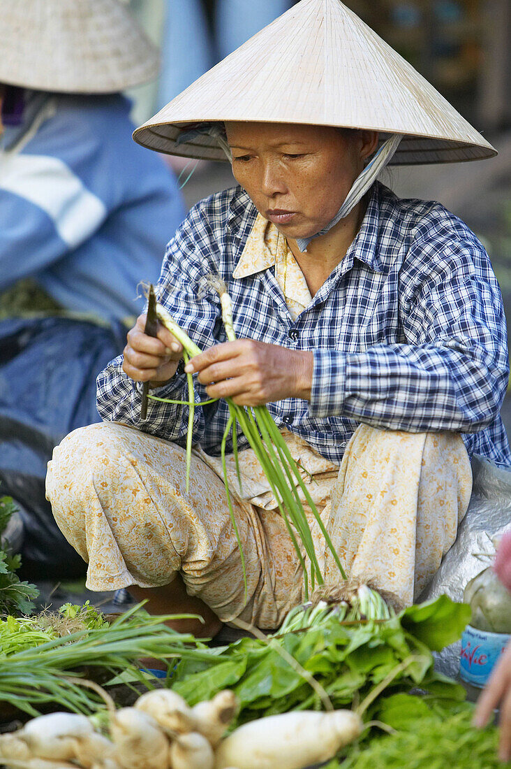 Woman selling produce at the market in Hoi An.