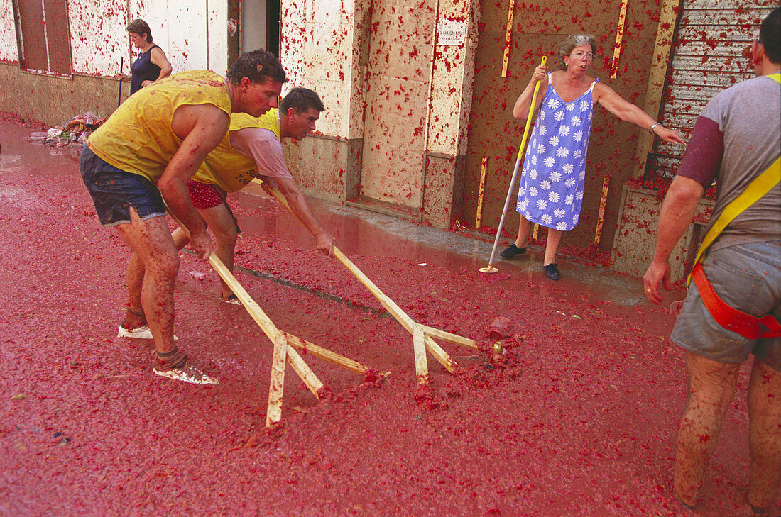 Cleaning up after the tomatina festival. Bunyol. Valencia province, Spain
