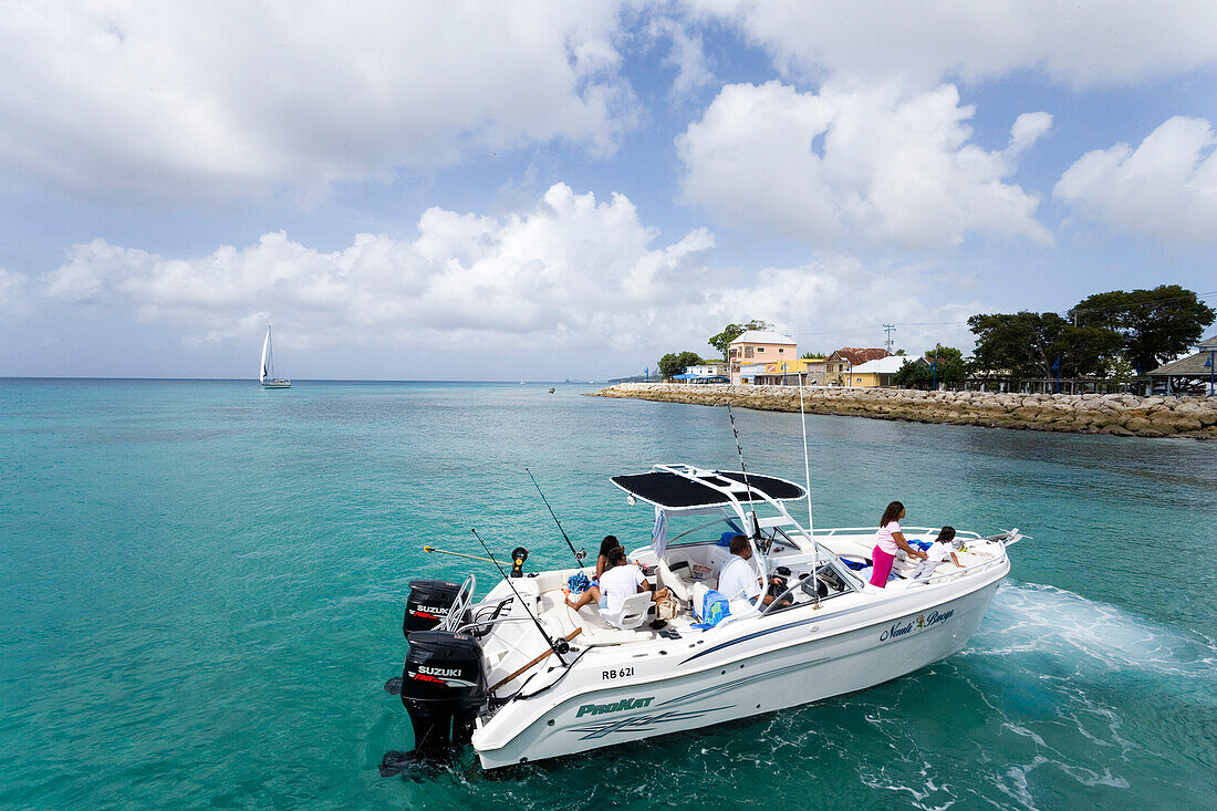 Persons in a motorboat near coast, Speightstown, Barbados, Caribbean