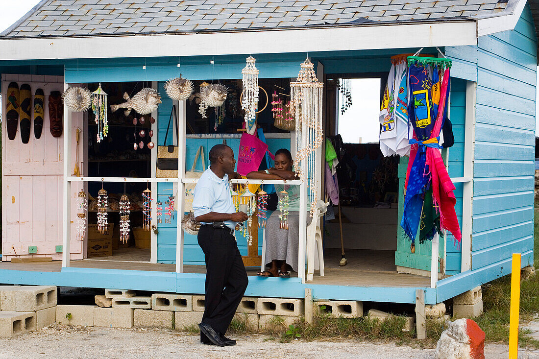 Two people at a souvenir shop at North Point, Barbados, Caribbean