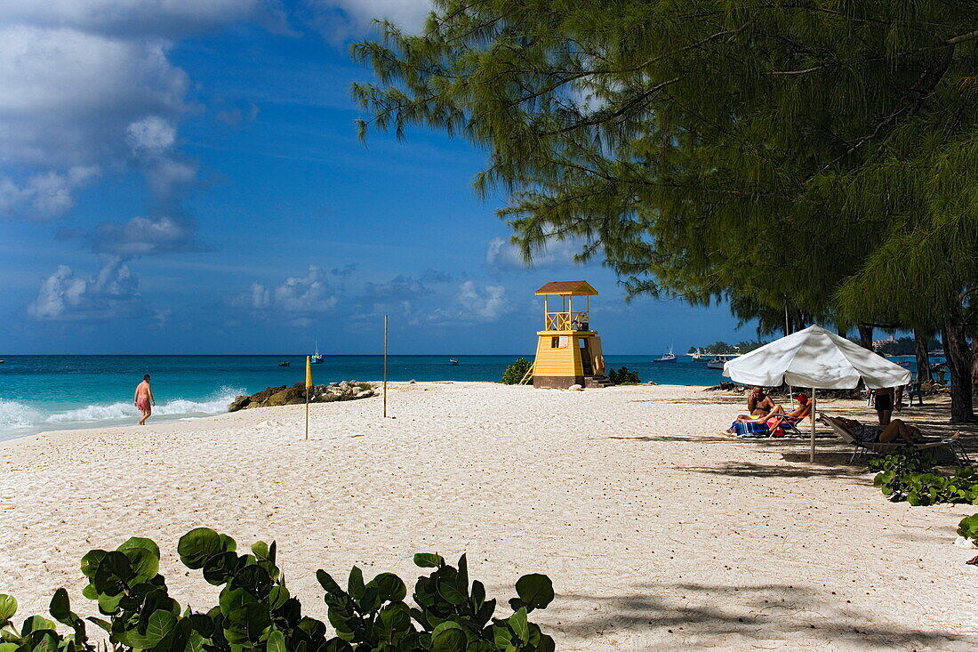 People sunbathing at Miami Beach, Oistins, Barbados, Caribbean