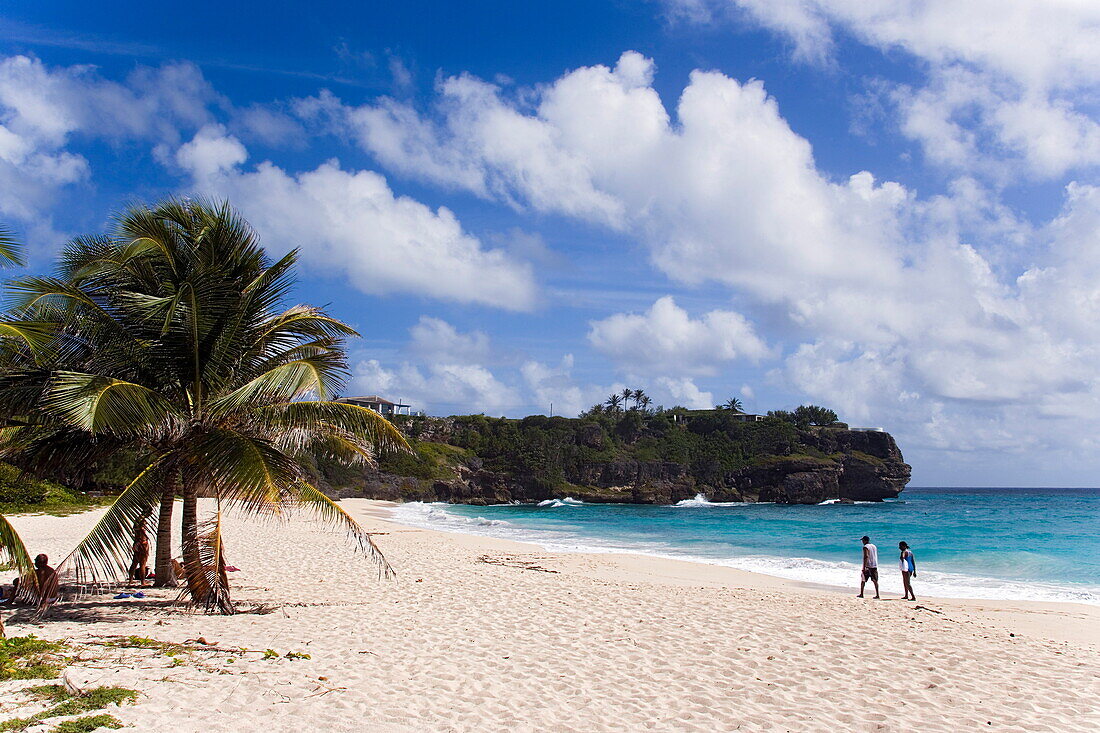 People walking along beach at Foul Bay, Barbados, Caribbean