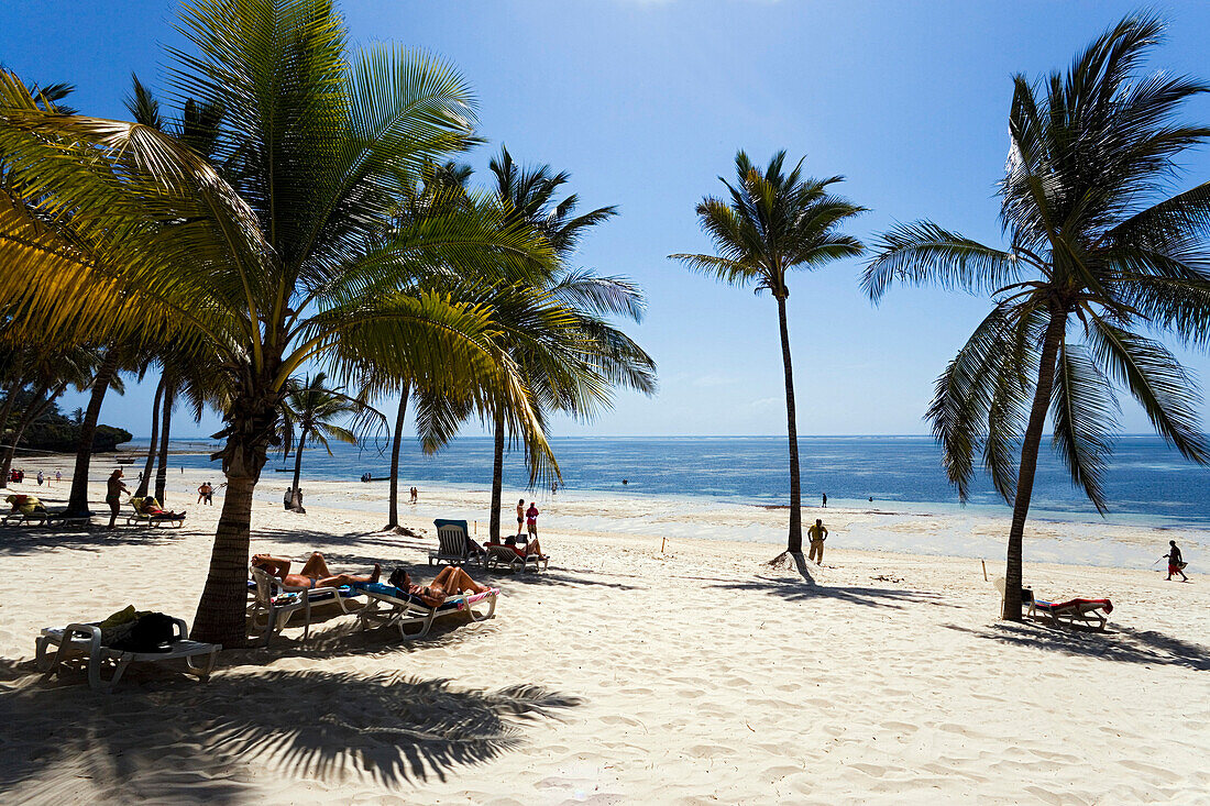 Tourists relaxing at Shanzu beach, Coast, Kenya