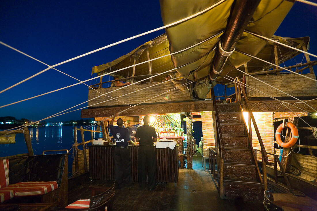 Illuminated ship Dhau of the restaurant Tamarind at night, Mombasa, Kenya