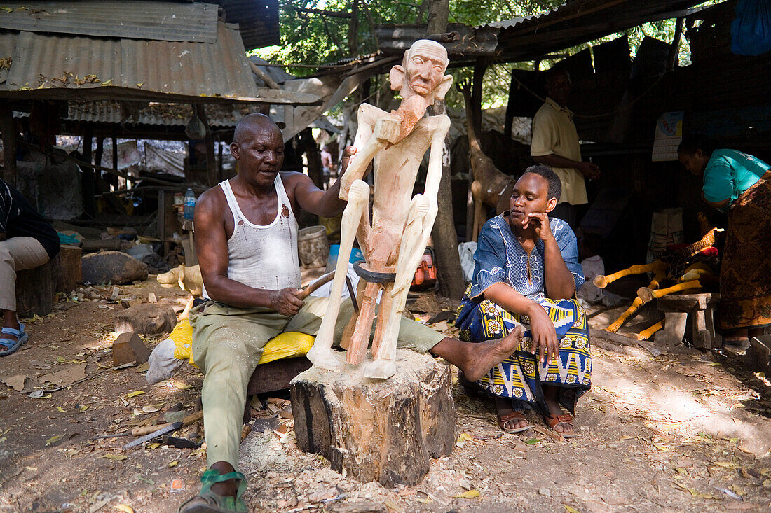 Man carving a figure, Akamba Village, Mombasa, Kenya