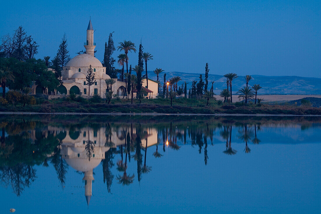 Hala Sultan Tekke mosque in the evening light, Larnaka Salt Lake, Larnaka, South Cyprus, Cyprus